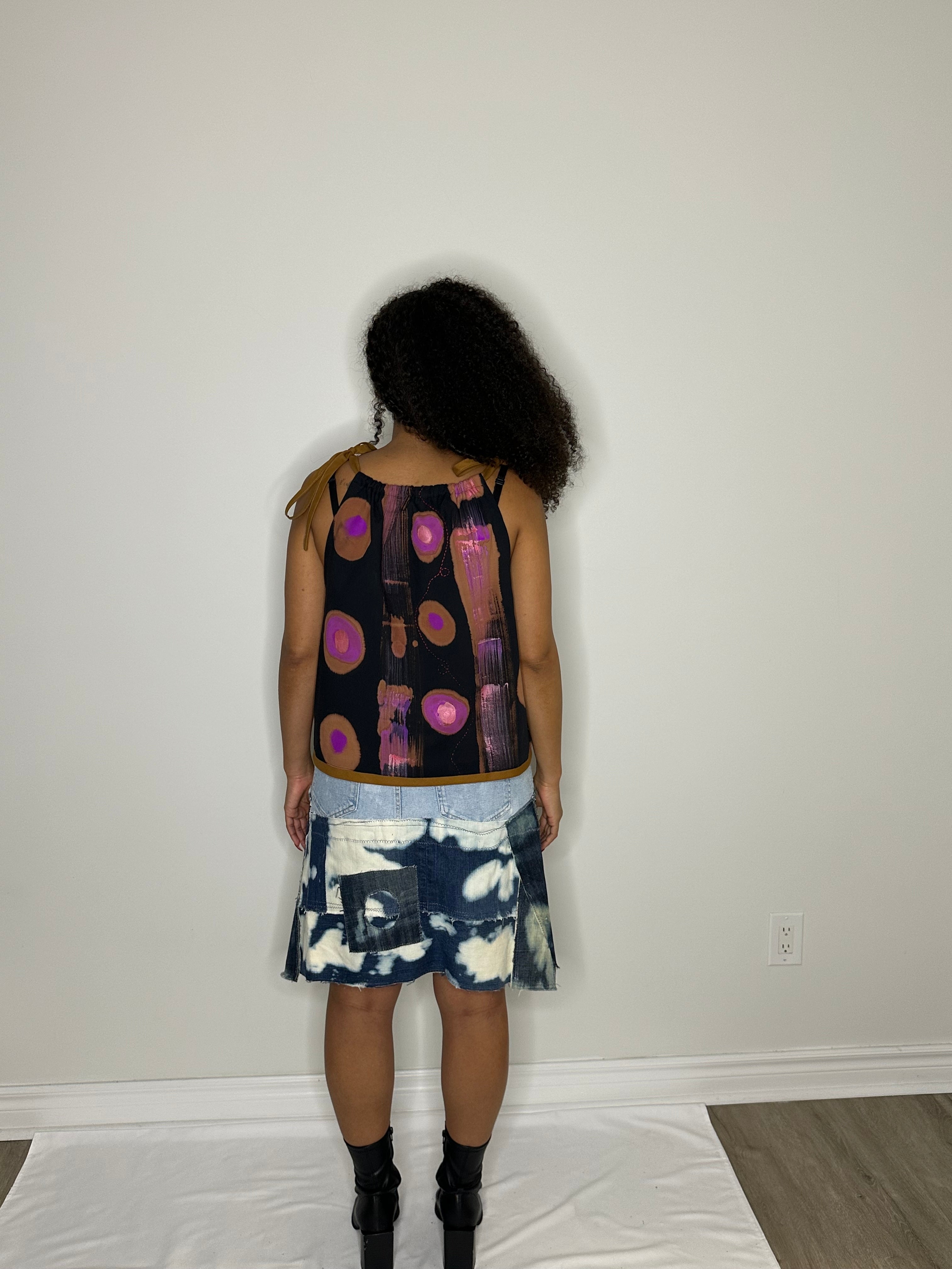 Patch Denim skirt and hand painted strap vest.