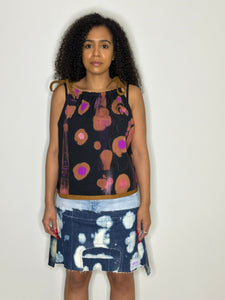 Patch Denim skirt and hand painted strap vest.